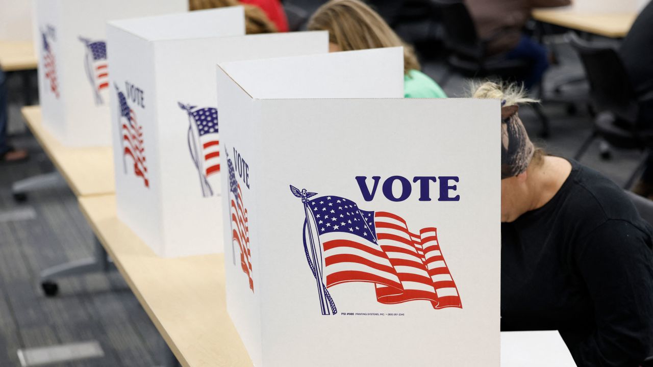 TOPSHOT - People cast their ballots on the last day of early voting for the general election in Michigan at the Livingston Educational Service Agency in Howell, Michigan on November 3, 2024. (Photo by JEFF KOWALSKY / AFP) (Photo by JEFF KOWALSKY/AFP via Getty Images)