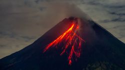 TOPSHOT - Mount Merapi spews lava onto its slopes during an eruption as seen from Srumbung village in Magelang, Central Java, on November 4, 2024. (Photo by DEVI RAHMAN / AFP) (Photo by DEVI RAHMAN/AFP via Getty Images)