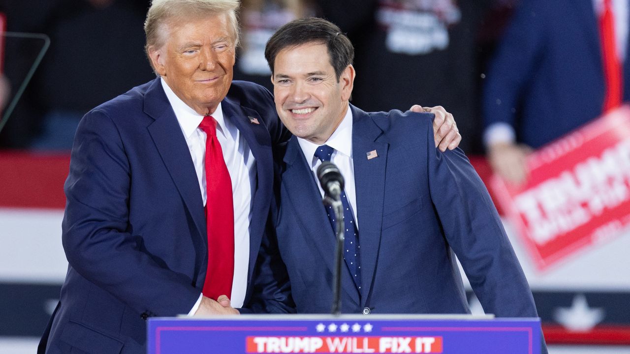 Former US President and Republican presidential candidate Donald Trump greets Senator Marco Rubio, Republican of Florida, during a campaign rally at the J.S. Dorton Arena in Raleigh, North Carolina, on November 4, 2024. Bitter rivals Kamala Harris and Donald Trump embark on a final frenzied campaign blitz Monday with both hitting must-win Pennsylvania on the last day of a tight and volatile US presidential election campaign. (Photo by Ryan M. Kelly / AFP) (Photo by RYAN M. KELLY/AFP via Getty Images)