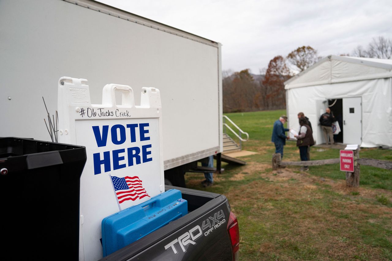 Election supplies are loaded into a voting tent set up by FEMA the day before the US presidential election, in Burnsville, North Carolina, on Monday.