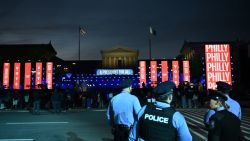 Police watch as people arrive for US Vice President and Democratic presidential candidate Kamala Harris's campaign rally on the Benjamin Franklin Parkway in Philadelphia, Pennsylvania, on November 4, 2024. (Photo by ANGELA WEISS / AFP) (Photo by ANGELA WEISS/AFP via Getty Images)