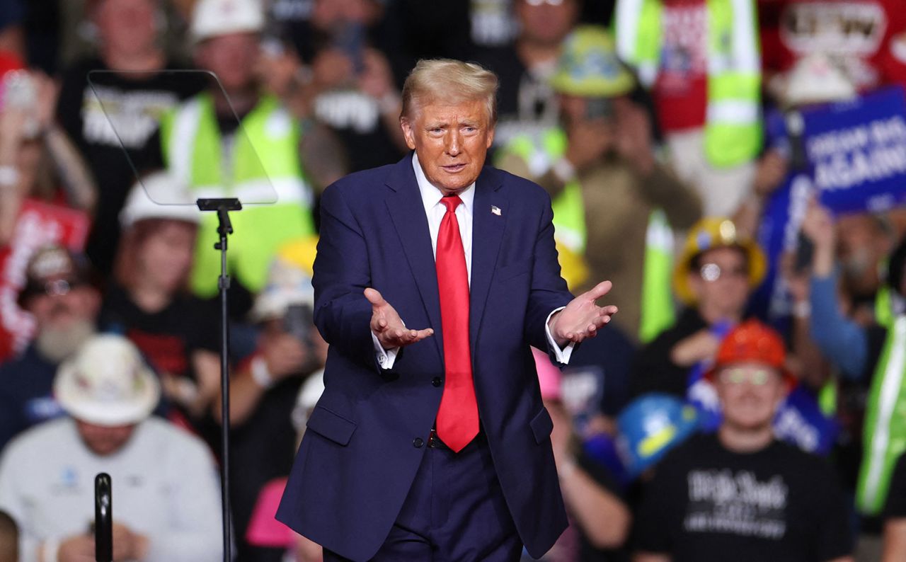 Former President Donald Trump gestures after speaking at a campaign rally in Pittsburgh, Pennsylvania on Monday, November 4.