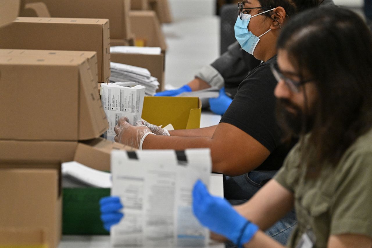 Election workers prepare mail-in ballots for tallying at the Los Angeles County Ballot Processing Center in City of Industry, California on November 4.