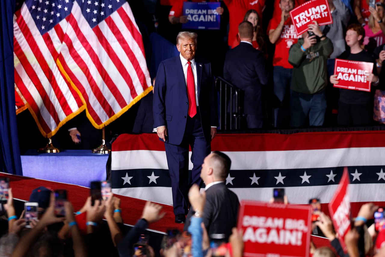 Former President Donald Trump walks on stage for his final campaign rally in Grand Rapids, Michigan on Monday, November 4.