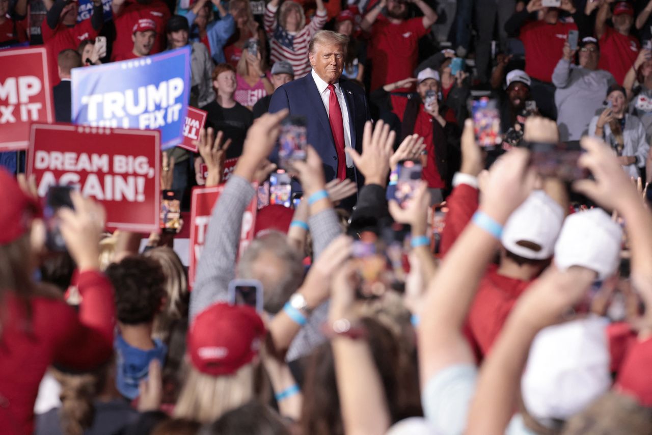 Former US President and Republican presidential candidate Donald Trump arrives to speak during his final campaign rally at the Van Andel Arena in Grand Rapids, Michigan, on the early morning of November 5.