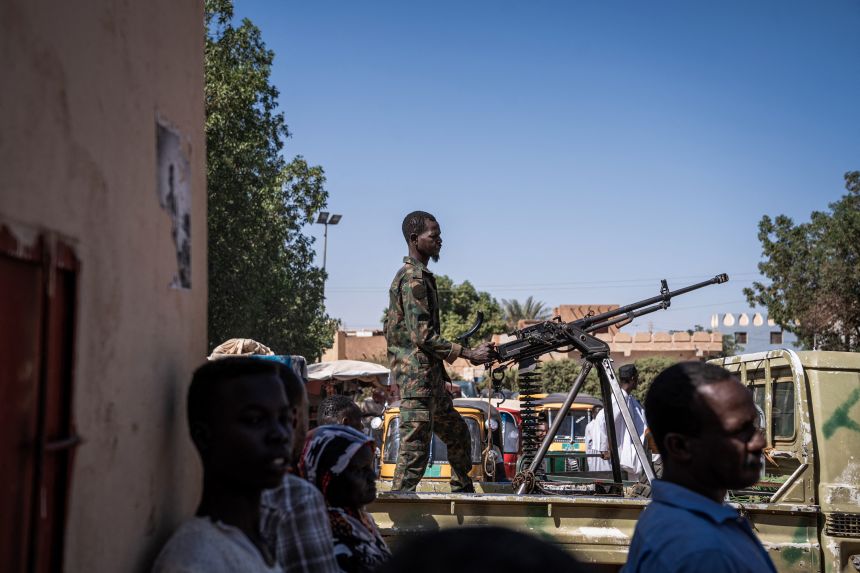 A Sudanese army soldier mans a machine gun on top of a military pickup truck outside a hospital in Omdurman on November 2, 2024.