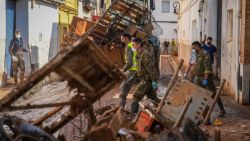 Members of Spain's military work to clear mud and debris from a street in Aldaia, in the region of Valencia, eastern Spain, on November 5, 2024,  following devastating floods. The death toll from Spain's worst floods in a generation has climbed to 217, according to resuers. (Photo by Cesar Manso / AFP) (Photo by CESAR MANSO/AFP via Getty Images)