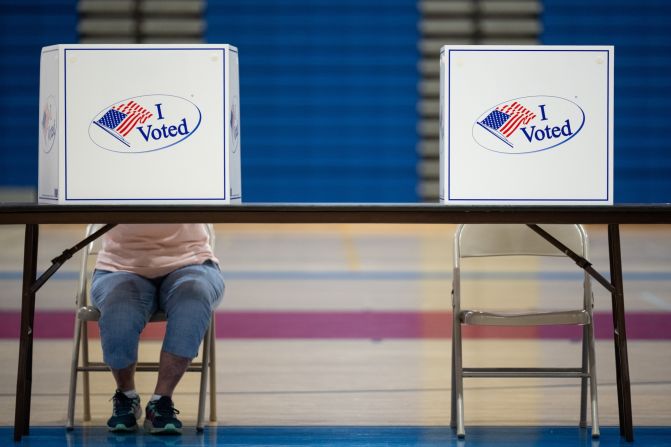 A voter fills out a ballot at a high school gymnasium in Alexandria, Virginia, on Tuesday.