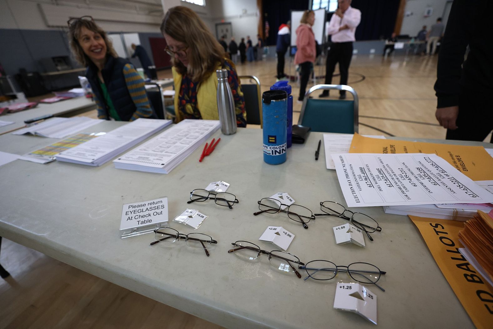 Reading glasses are available at a polling location in Boston on Tuesday.