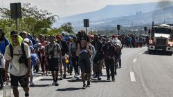 Migrants of different nationalities walk to the United States in a caravan along a highway in Tuxtla Gutierrez, Chiapas State, Mexico, on November 5, 2024. (Photo by Isaac GUZMAN / AFP) (Photo by ISAAC GUZMAN/AFP via Getty Images)