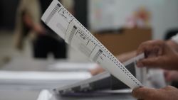 Voters fill out their ballots at a polling place on Election Day in San Juan, Puerto Rico, November 5, 2024. (Photo by Jaydee Lee Serrano / AFP) (Photo by JAYDEE LEE SERRANO/AFP via Getty Images)