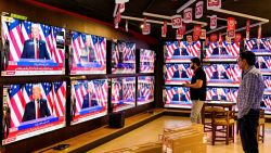 Men watch a televison broadcast at a shop in Islamabad on November 6, 2024, featuring US former president and Republican presidential candidate Donald Trump as he addresses an election night event at Florida. Republican former president Donald Trump closed in on a new term in the White House early November 6, 2024, just needing a handful of electoral votes to defeat Democratic Vice President Kamala Harris. (Photo by Farooq NAEEM / AFP) (Photo by FAROOQ NAEEM/AFP via Getty Images)