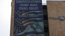 A large billboard congratulating US Republican presidential candidate and former president Donald Trump, hangs on the side of a building in Jerusalem on November 6, 2024. Israel's Prime Minister Benjamin Netanyahu on November 6 congratulated Donald Trump, who has won the US presidential election, calling it "history's greatest comeback" and a new beginning in the US-Israel alliance. (Photo by AHMAD GHARABLI / AFP) (Photo by AHMAD GHARABLI/AFP via Getty Images)