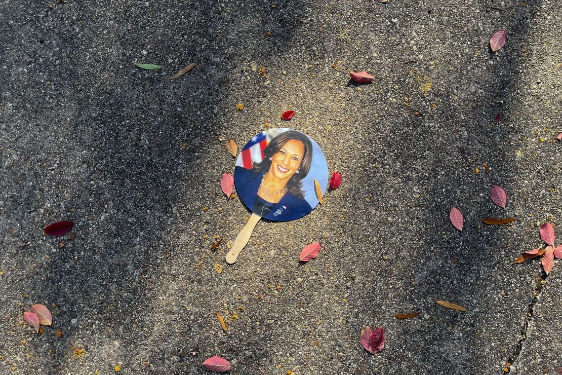 A hand fan depicting Harris is left on a sidewalk in Washington, DC, on November 6, 2024.