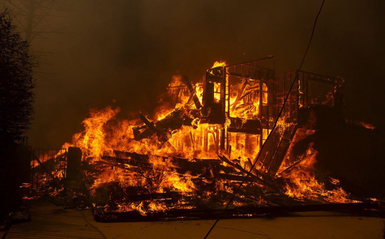 A house is engulfed in the flames of the Mountain Fire in Camarillo, California, on November 6.