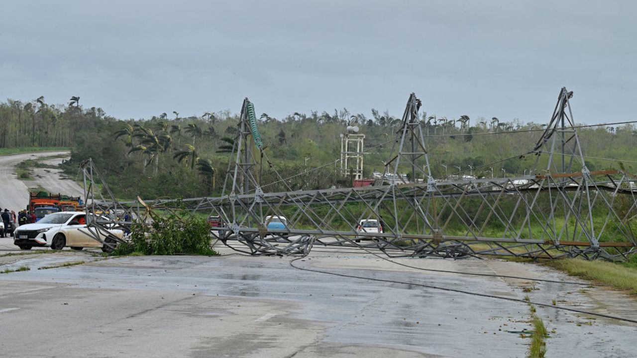 A high tension electric tower knocked down during the passage of Hurricane Rafael blocks the road linking Artemisa with Havana, on November 7, 2024. Cubans on Thursday were assessing the damage caused by Hurricane Rafael which lashed the island and plunged it into darkness but caused no reported fatalities so far. Rafael hit western Cuba on Wednesday as a major Category 3 hurricane and swept across the island in two and a half hours before losing intensity as it entered the Gulf of Mexico. (Photo by ADALBERTO ROQUE / AFP) (Photo by ADALBERTO ROQUE/AFP via Getty Images)