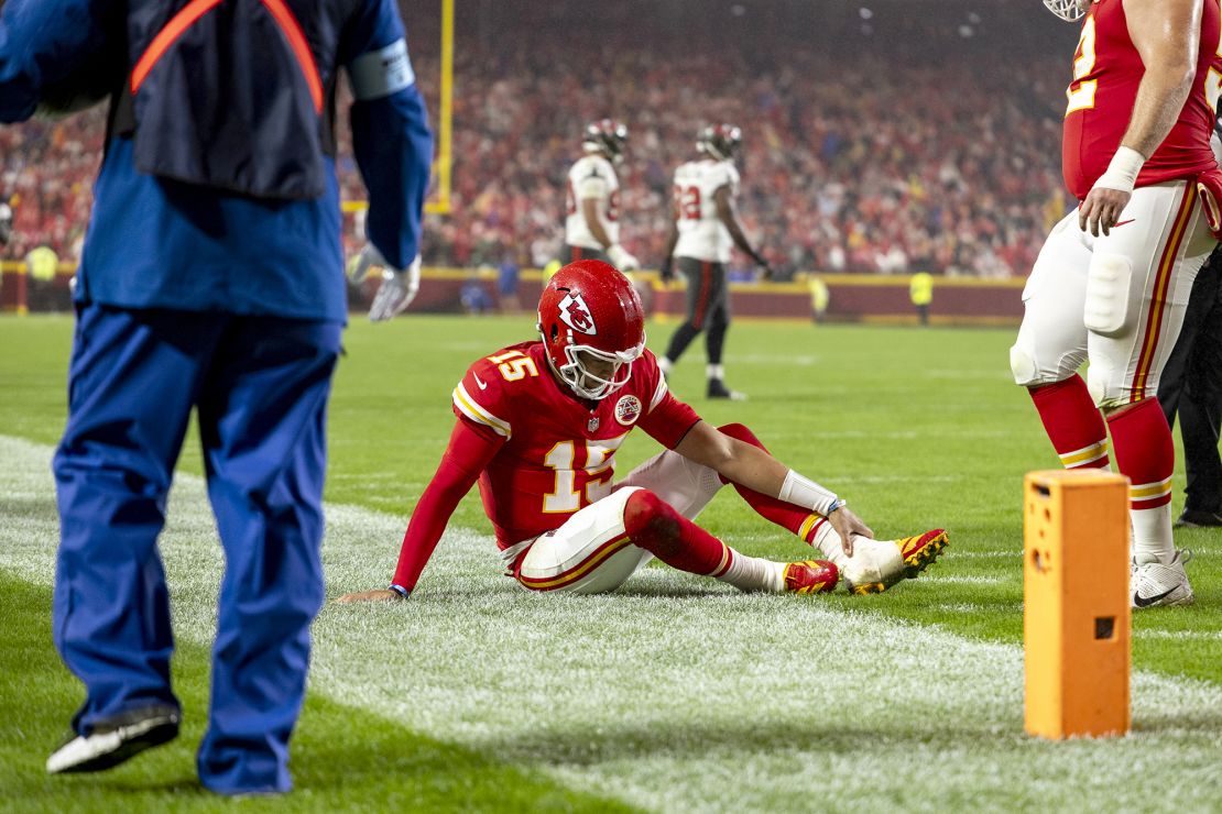 Mahomes clutches his ankle during the game against Tampa Bay.