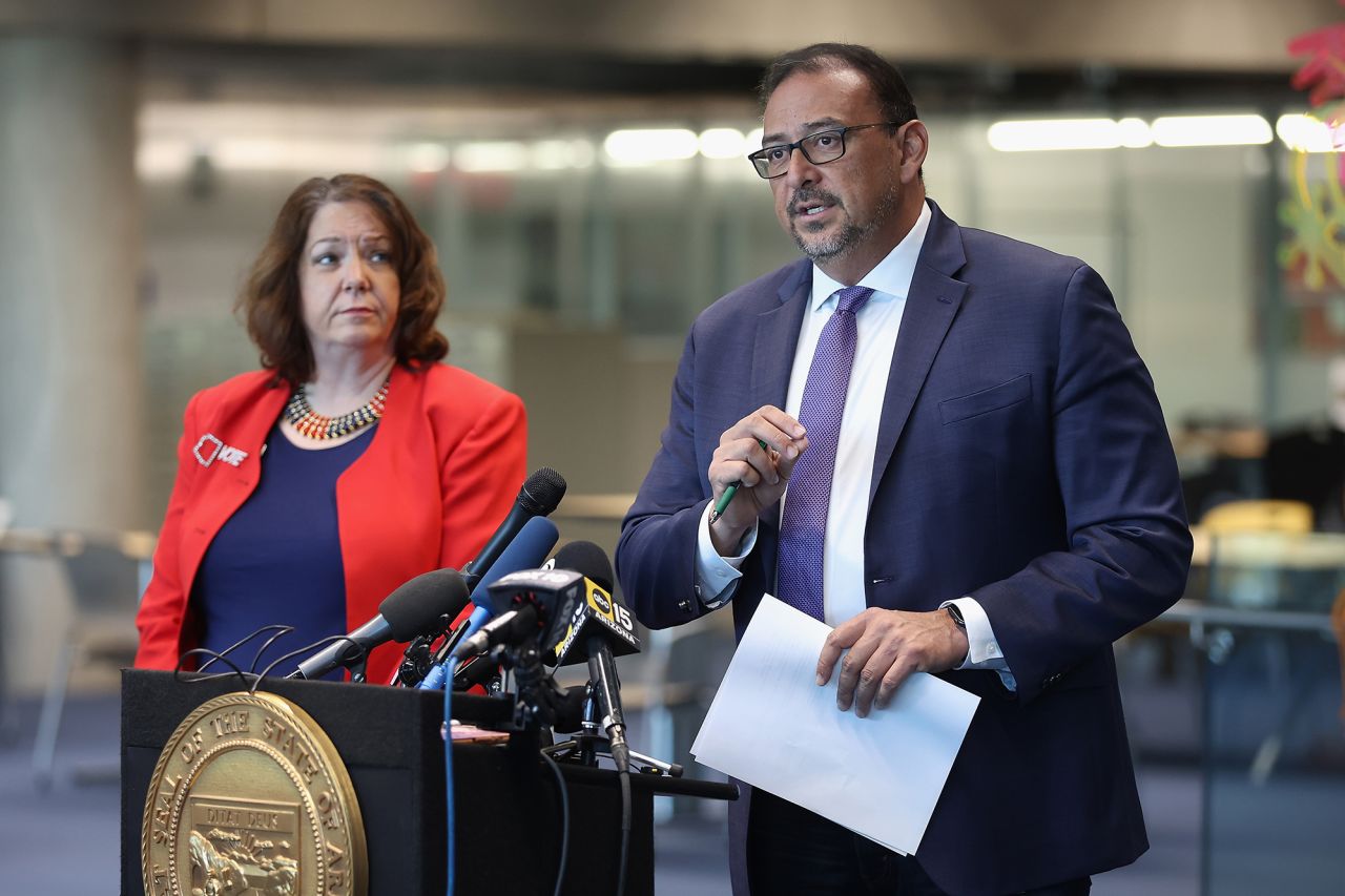 Arizona Secretary Of State Adrian Fontes (R) speaks with the media, alongside State Election Director Lisa Marra, at the Burton Barr Central Library on November 5 in Phoenix, Arizona.