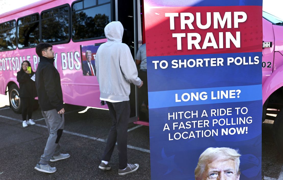Voters board a party bus dubbed the