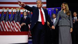 WEST PALM BEACH, FLORIDA - NOVEMBER 06:  Republican presidential nominee, former U.S. President Donald Trump points to supporters with former first lady Melania Trump during an election night event at the Palm Beach Convention Center on November 06, 2024 in West Palm Beach, Florida. Americans cast their ballots today in the presidential race between Republican nominee former President Donald Trump and Vice President Kamala Harris, as well as multiple state elections that will determine the balance of power in Congress.   (Photo by Chip Somodevilla/Getty Images)