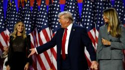 WEST PALM BEACH, FLORIDA - NOVEMBER 06:  Republican presidential nominee, former U.S. President Donald Trump reacts on stage with Lara Trump (L) and former first lady Melania Trump (R) during an election night event at the Palm Beach Convention Center on November 06, 2024 in West Palm Beach, Florida. Americans cast their ballots today in the presidential race between Republican nominee former President Donald Trump and Vice President Kamala Harris, as well as multiple state elections that will determine the balance of power in Congress.   (Photo by Chip Somodevilla/Getty Images)