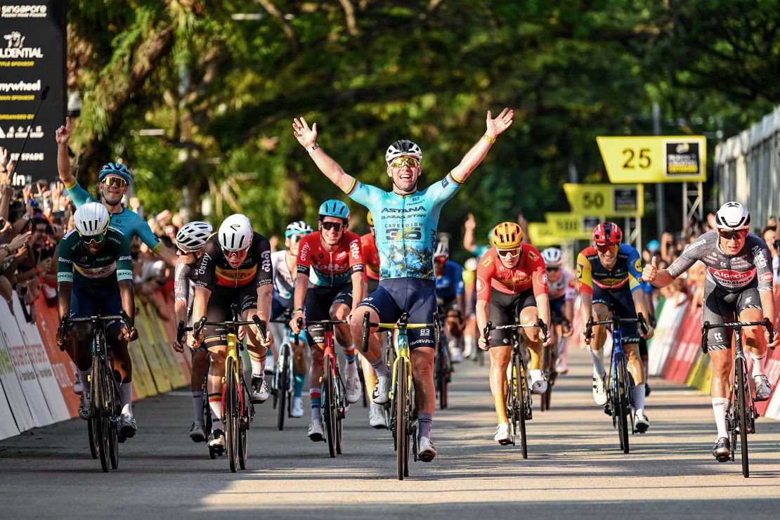 Britain's Mark Cavendish celebrates as he crosses the finish line during the third Tour de France Singapore Criterium race.