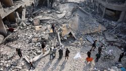 Palestinians check the rubble of the Alloush family's house, levelled in an Israeli strike in Jabalia in the northern Gaza Strip on November 10, 2024.