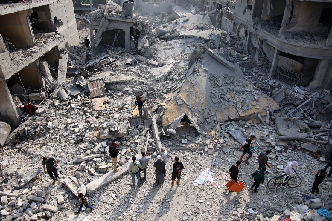 Palestinians check the rubble of the Alloush family's house, levelled in an Israeli strike in Jabalya in the northern Gaza Strip on Sunday.