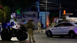 Mexican Army soldiers and public security agents stand guard outside the Los Cantaritos bar where an armed group broke in on the eve, killing ten people and leaving at least seven more injured, in the city of Queretaro, state of Queretaro, Mexico, on November 10, 2024. (Photo by MARIO ARMAS / AFP) (Photo by MARIO ARMAS/AFP via Getty Images)