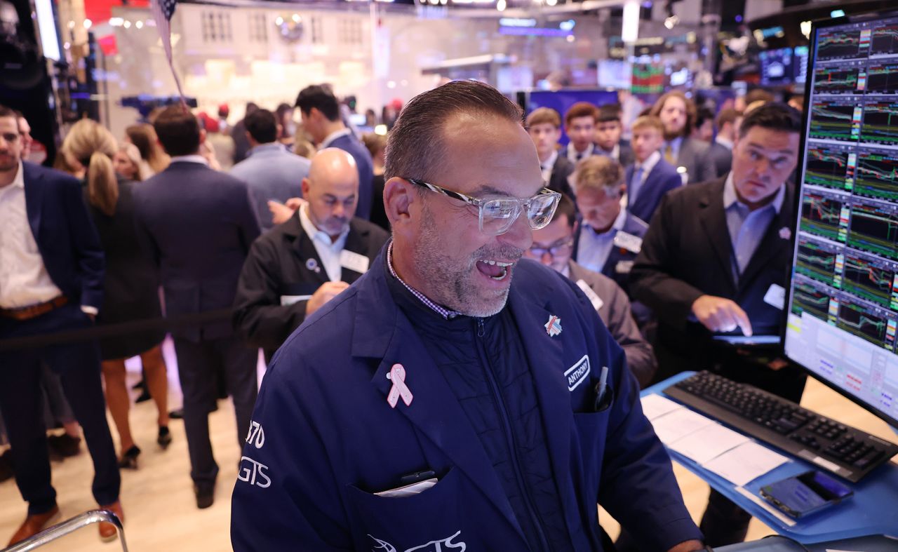 Traders work on the floor of the New York Stock Exchange during the morning trading on November 7,  in New York City.