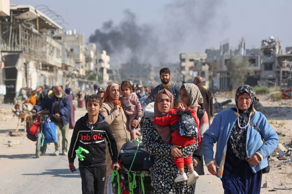 TOPSHOT - Palestinians displaced from shelters in Beit Hanoun cross the main Salaheddine road into Jabalia in the northern Gaza Strip following Israeli army evacuation orders on November 12, 2024, amid the ongoing war in the Palestinian territory between Israel and Hamas. (Photo by Omar AL-QATTAA / AFP) (Photo by OMAR AL-QATTAA/AFP via Getty Images)