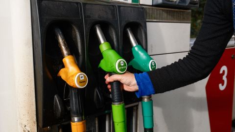 A person grabbing a gas pump at the Intermarche gas station in Clermont Ferrand  on November 9 2024. (Photo by Romain Costaseca / Hans Lucas / Hans Lucas via AFP) (Photo by ROMAIN COSTASECA/Hans Lucas/AFP via Getty Images)