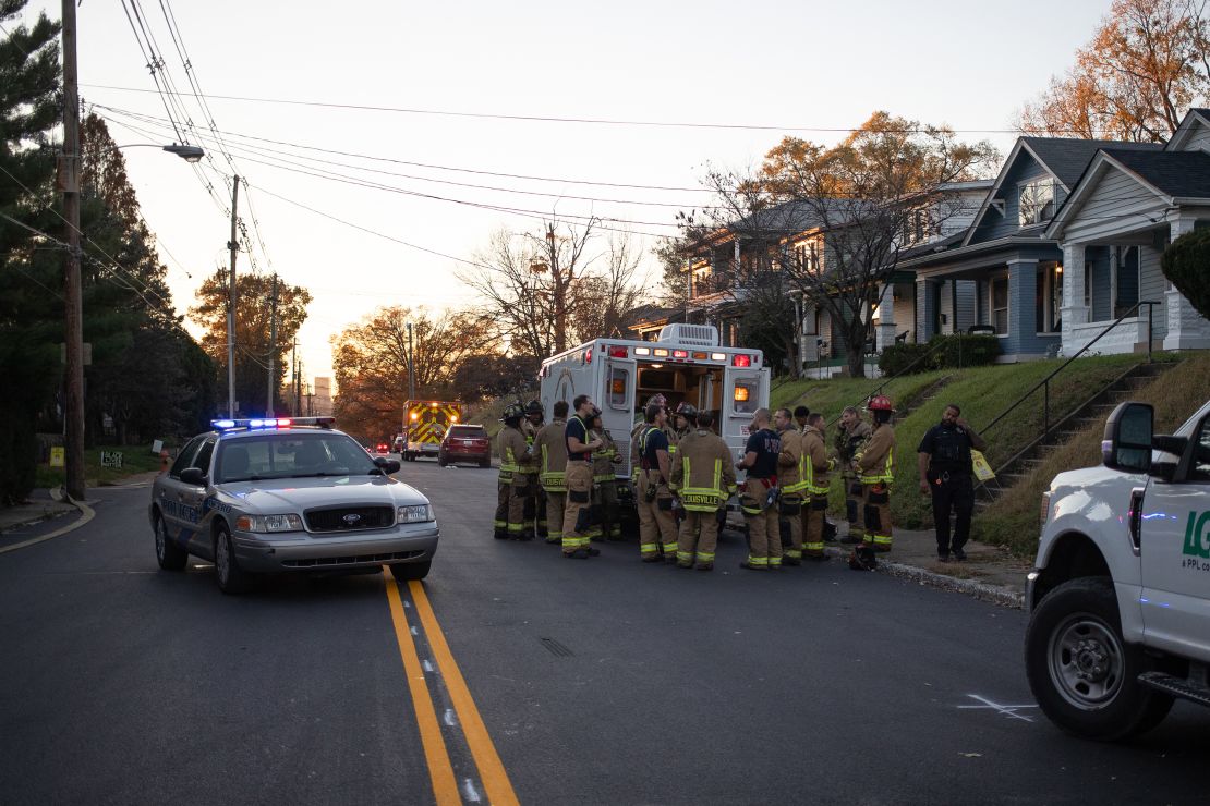 Firefighters gather near an emergency services vehicle after an explosion in the Clifton area of ​​Louisville, Kentucky, on Nov. 12, 2024. At least 11 people were injured in an explosion at the Givaudan Sense Color facility, US media reported. (Photo credit: LEANDRO LOZADA / AFP) (Photo credit: LEANDRO LOZADA/AFP /AFP via Getty Images)