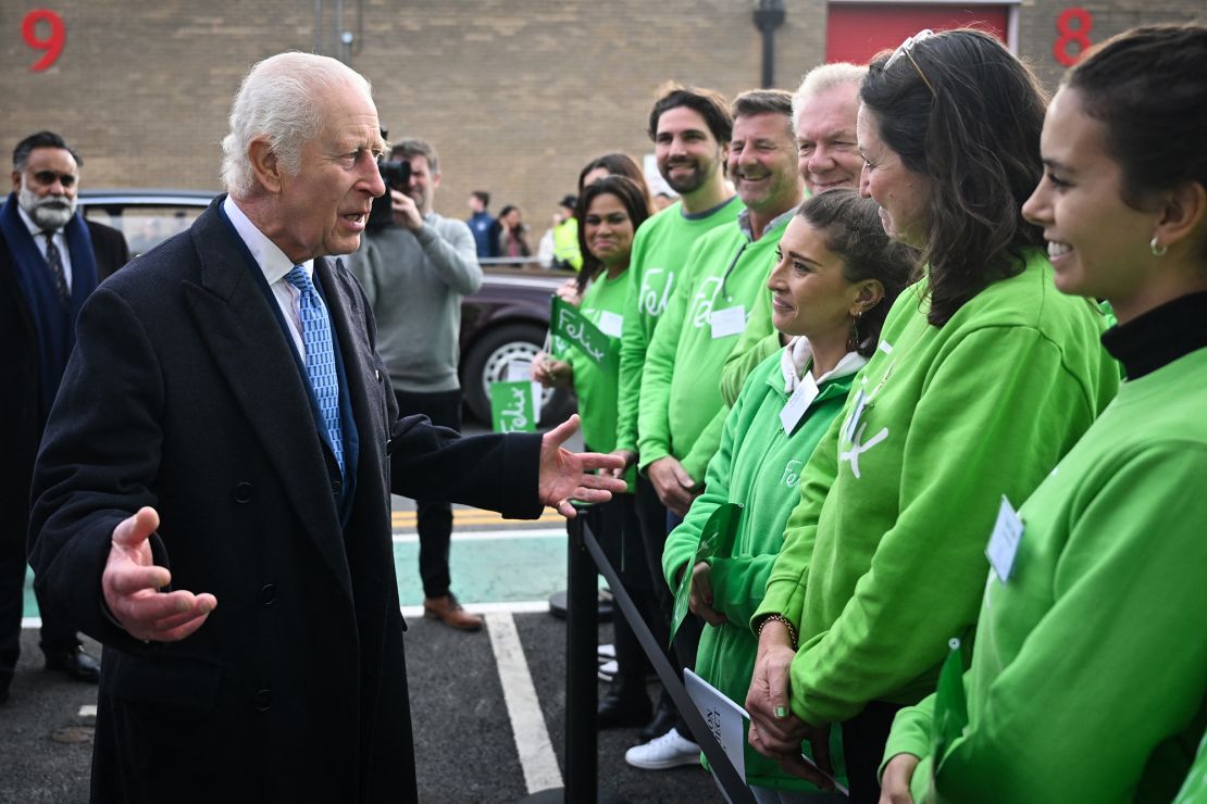 Charles speaks with staff at the new distribution center, designed to save and circulate surplus food and to support communities in need. 