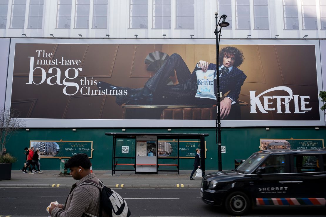 "Posh" Kettle crisps advertised on a billboard in the center of London.