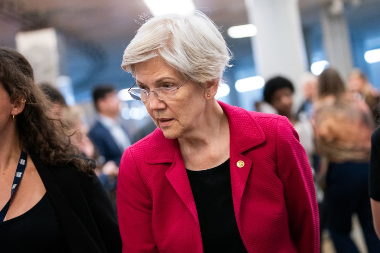 Warren speaks to reporters on her way to a vote at the US Capitol in Washington, DC, in November 2024.