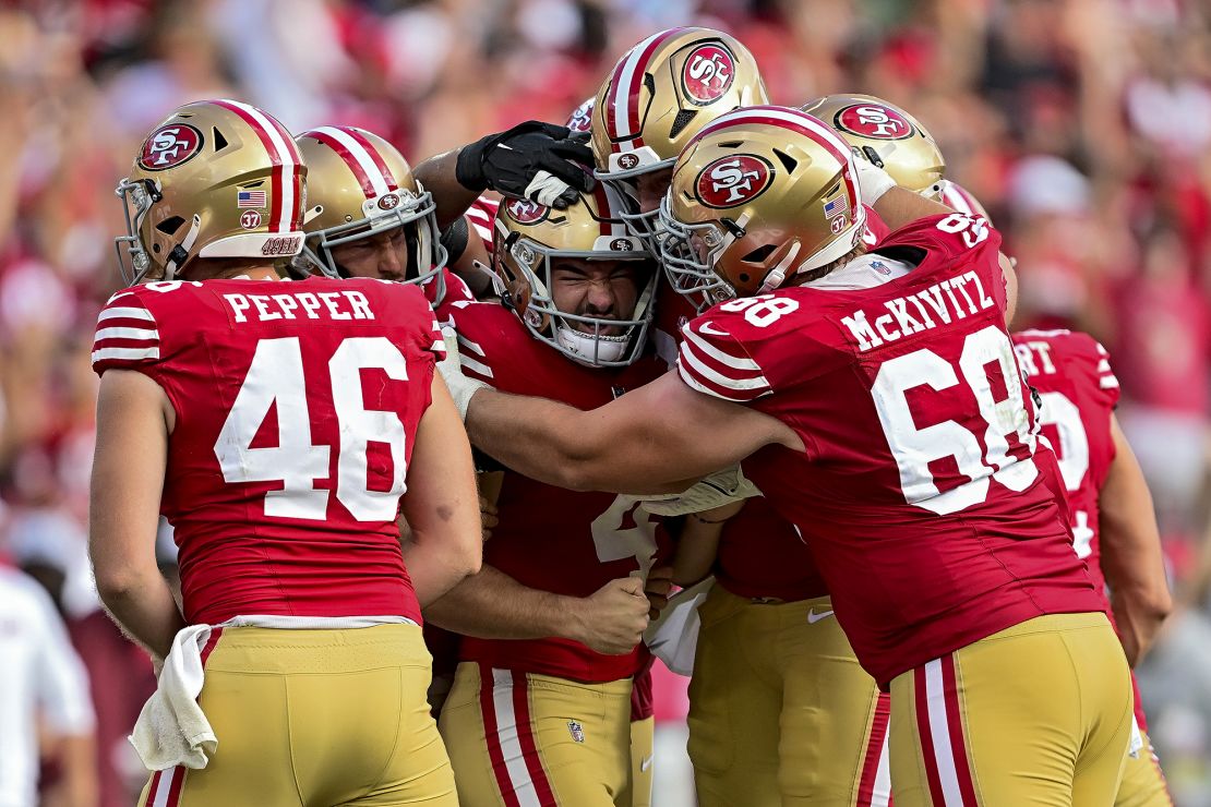 Moody (center) celebrates with his 49ers teammates after scoring the game-winning field goal against the Buccaneers.