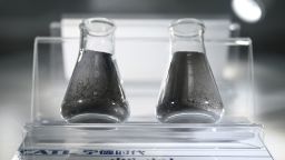 Graphite powder, left, and powder made from nickel, copper and magnesium, right, which are used to make lithium-ion batteries, are displayed in the showroom of Chinese EV battery maker CATL. The United States just imposed an additional 93.5% tariffs on graphite imports from China, which could significantly raise the cost of building electric vehicles at American plants.