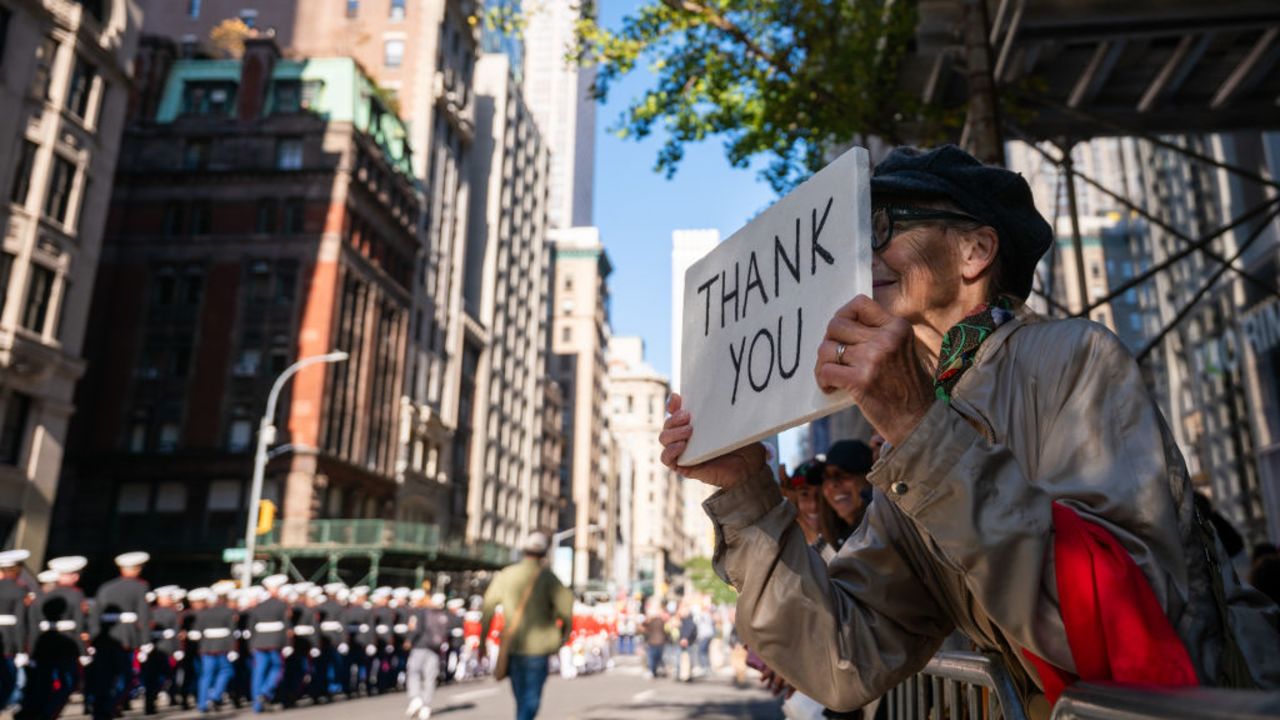 NEW YORK, NEW YORK - NOVEMBER 11:  A person shows their appreciation as members of the military and others participate in the 105th annual Veterans Day Parade on November 11, 2024, in New York City. Hundreds of people lined 5th Avenue to watch the biggest Veterans Day parade in the United States. This year's event included veterans, active soldiers, police officers, firefighters, and dozens of school groups participating in the parade, which honors the men and women who have served and sacrificed for the country.  (Photo by Spencer Platt/Getty Images)