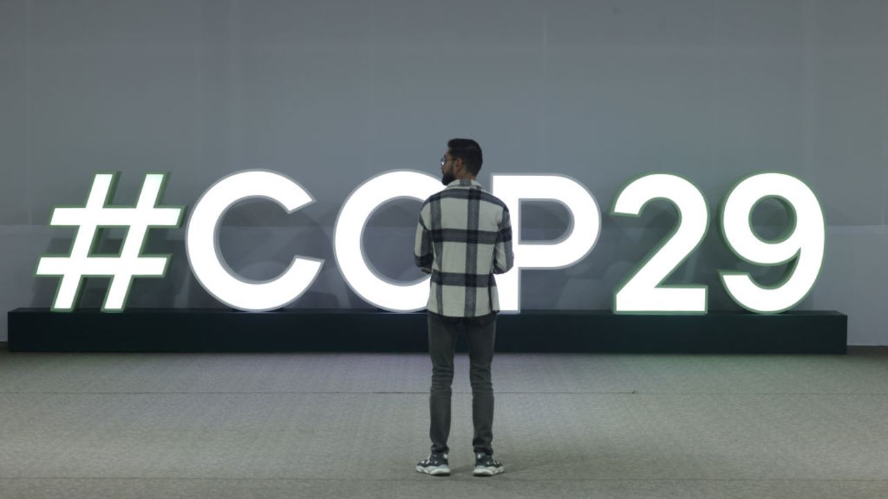 BAKU, AZERBAIJAN - NOVEMBER 12: A man stands in front of an illuminated hashtag COP29 logo on day two at the UNFCCC COP29 Climate Conference on November 12, 2024 in Baku, Azerbaijan. The COP29, which is running from November 11 through 22, is bringing together stakeholders, including international heads of state and other leaders, scientists, environmentalists, indigenous peoples representatives, activists and others to discuss and agree on the implementation of global measures towards mitigating the effects of climate change. According to the United Nations, countries made no progress over the last year in reducing global emissions from the burning of fossil fuels. (Photo by Sean Gallup/Getty Images)