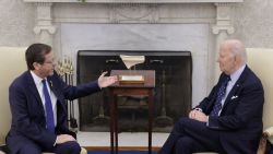 WASHINGTON, DC - NOVEMBER 12: President Isaac Herzog (L) of Israel presents to U.S. President Joe Biden (R) with an artifact from the foot of Temple Mount in Jerusalem that has the word "Joseph" on it during a meeting in the Oval Office of the White House on November 12, 2024 in Washington, DC. Biden met with Herzog to discuss the peace process in Gaza and Lebanon.  (Photo by Alex Wong/Getty Images)