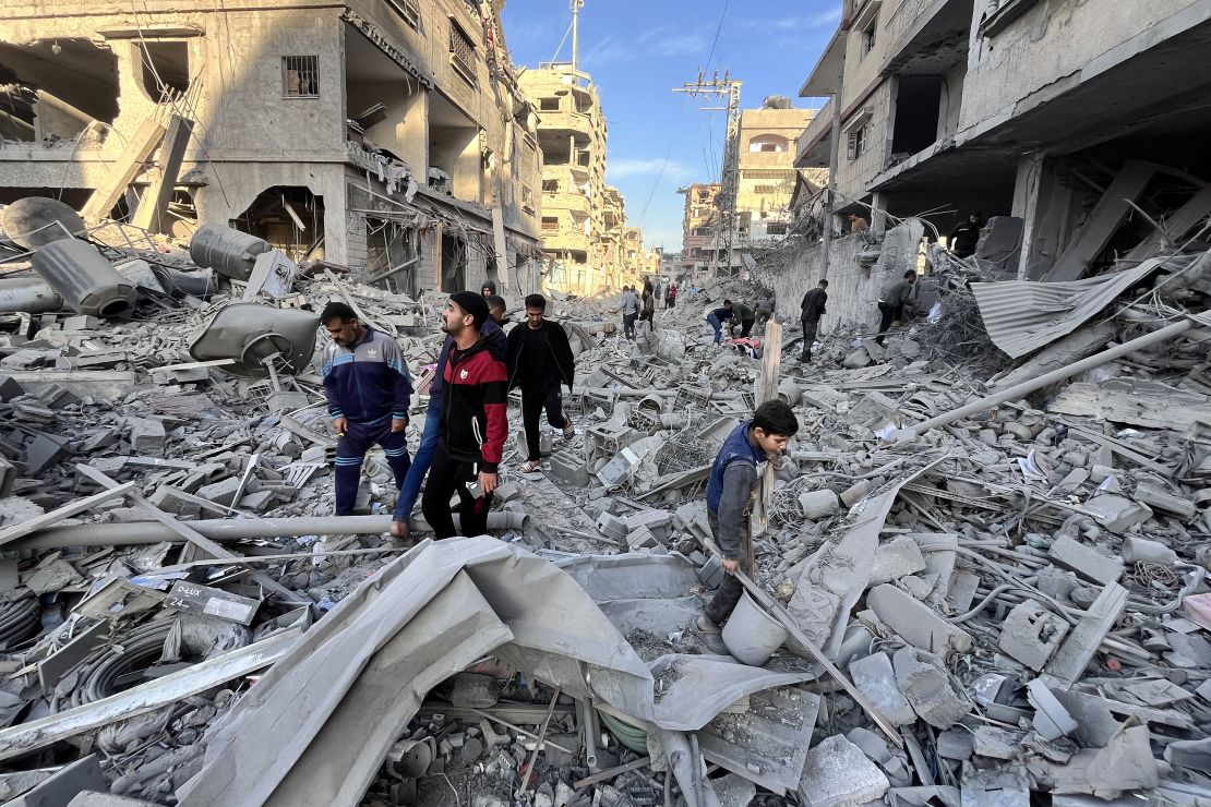 People check the rubble of a building hit in an overnight Israeli strike in Beit Lahya in the northern Gaza Strip on November 17, 2024.