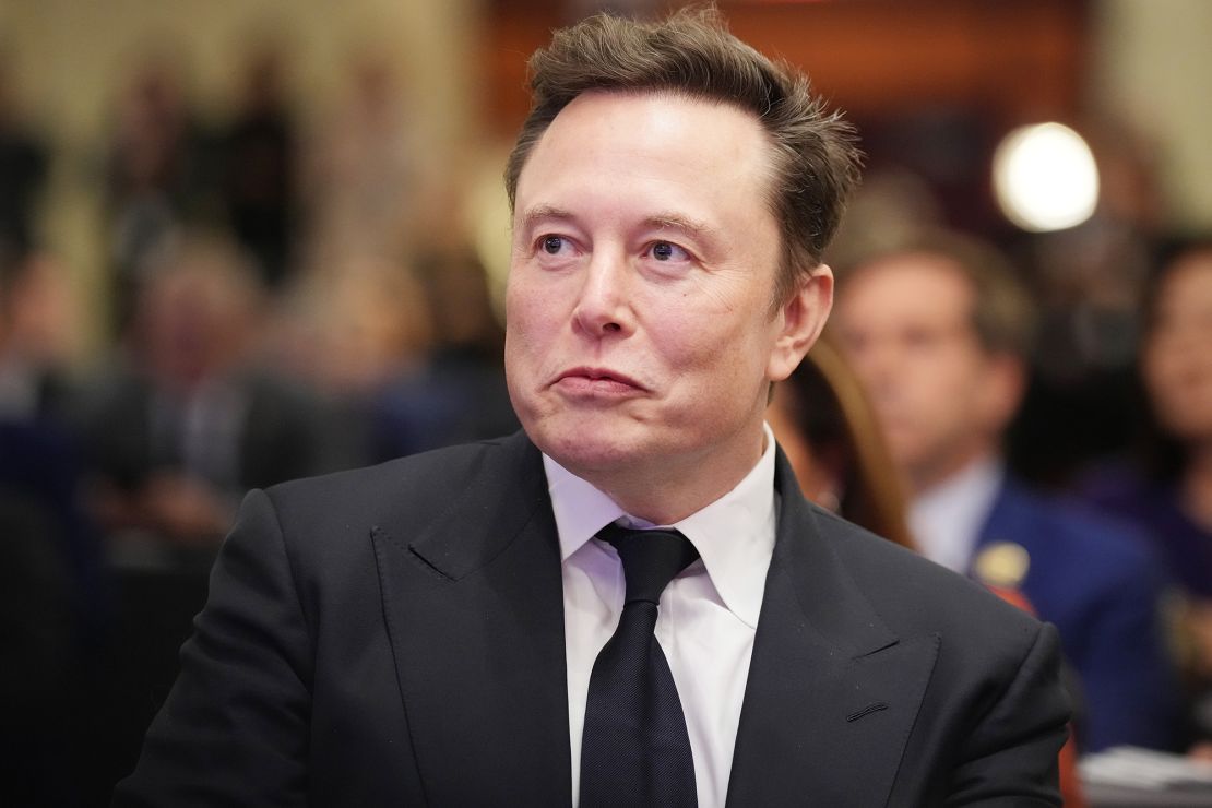 Elon Musk listens in November as then-President-elect Donald Trump addresses a House Republicans Conference meeting at the Hyatt Regency on Capitol Hill on November 13, 2024 in Washington, DC.