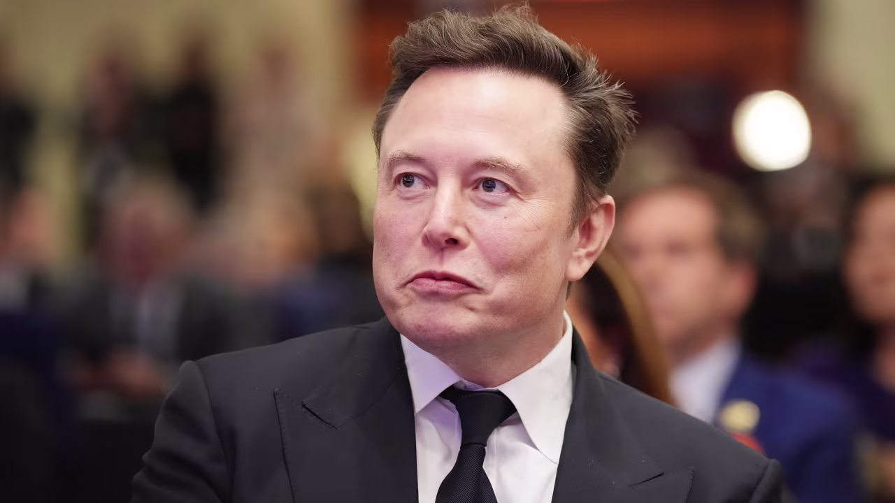 Elon Musk listens as President-elect Donald Trump addresses a House Republicans Conference meeting in Washington, DC, on November 13.
