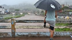 A man looks at the flooding of the Choluteca river in Tegucigalpa on November 17, 2024, due to the heavy rains left by tropical storm Sara. Tropical storm Sara left 45,329 people affected in Honduras, of which more than a thousand have been left homeless or taken to shelters, according to local authorities. (Photo by Orlando SIERRA / AFP) (Photo by ORLANDO SIERRA/AFP via Getty Images)