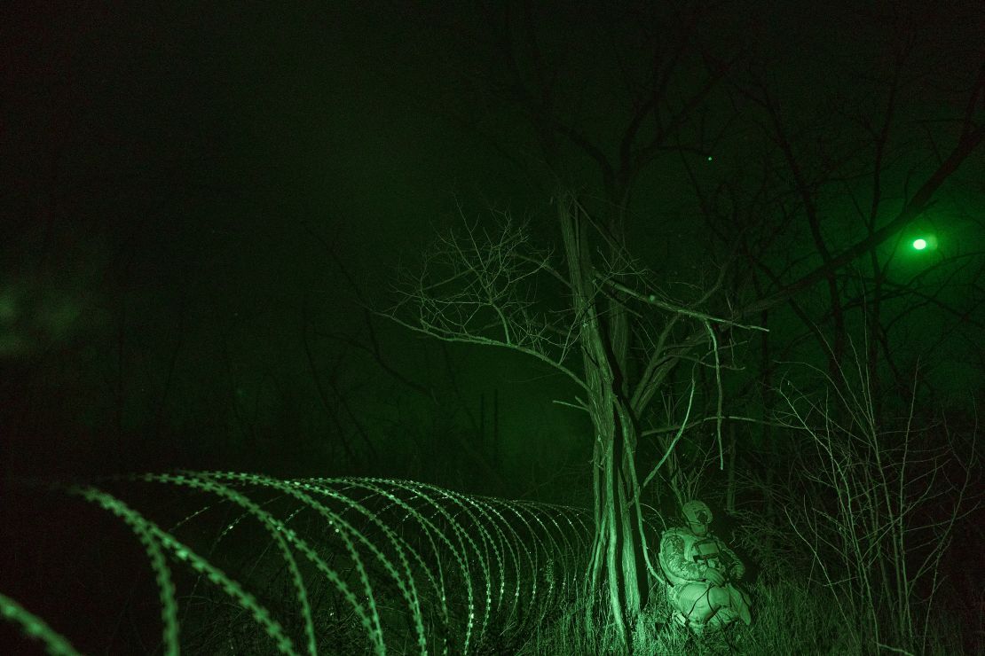 In a picture taken with a night vision camera, a unit of miners carries out a combat mission to mine the territory between Ukrainian and Russian positions with remotely controlled mines in Pokrovsk Frontline, Ukraine, on November 17, 2024.