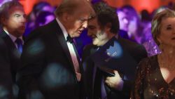 PALM BEACH, FLORIDA - NOVEMBER 14: Argentine President Javier Milei walks past U.S. President-elect Donald Trump as they attend the America First Policy Institute Gala held at Mar-a-Lago on November 14, 2024 in Palm Beach, Florida. The annual event supports Grey Team, a nonprofit organization dedicated to preventing military suicide. (Photo by Joe Raedle/Getty Images)