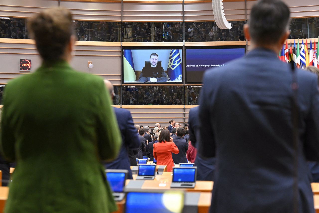 Members of the EU Parliament applaud at the end of a videoconference speech by Ukrainian President Volodymyr Zelensky at the EU Parliament in Brussels, Belgium, on Tuesday.