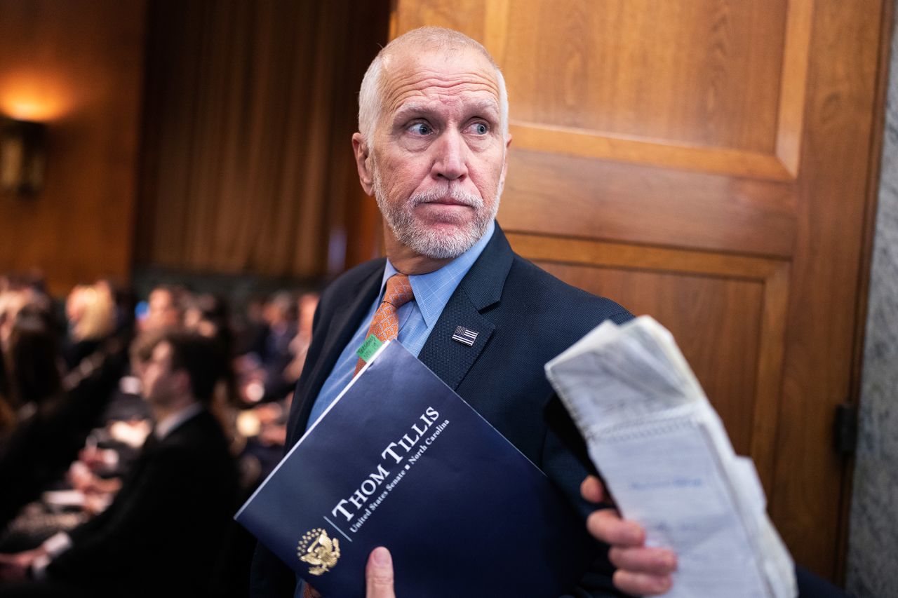 Sen. Thom Tillis speaks with reporters in the Dirksen Senate Office Building, on November 19.