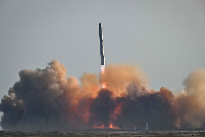 SpaceX calls off nail-biting catch attempt as booster splashes down to Earth